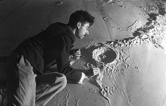 An early exhibit commissioned for the Griffith Observatory was a 38’ plaster scale model section of the moon. Architect and astronomer Roger Hayward (pictured here) assured the accuracy of the model sculpted by Caspar Gruenfeld. Security Pacific National.