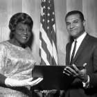 Madame AC Bilbrew receives a resolution from Councilman Billy Mills in 1956.