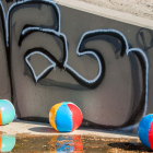 During one of photographer Fred Kaplan’s many trips to the River, he found the bed and banks peppered with inflatable beach balls. (2022 Fred Kaplan/LA River X Collection)