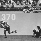 Cubs outfielder Rick Monday stops two protestors from lighting an American flag on fire during a game at Dodger Stadium in 1976. James Roark/Herald Examiner Collection