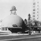 Exterior of a dome-shaped building with signage that reads "Eat in the hat" and "The Brown Derby"