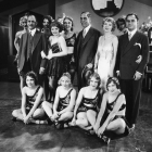 On the set of "The Woman Racket" at Metro-Goldwyn-Mayer Studios, Sir Jagjit Singh of India (in the center with moustache) is surrounded by a group of young starlets and chorus girls, including Sally Starr (standing, fourth from left), Ann Dvorak (standing, fifth from left), and Blanche Sweet (standing, third from right). 1930 – Eyre Powell Chamber of Commerce Collection