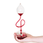 glass contraption held in the palm of a hand