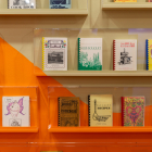 Shelves showcasing cookbooks from the L.A. Community Cookbook Archive.