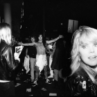 black and white photo of line outside Rainbow Bar & Grill