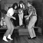 black and white photo of teenagers dancing