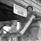 The denazification program in Germany mandated the elimination of Nazi names from public squares, city streets, and other venues. US, Soviet, and British soldiers enthusiastically removed Nazi emblems and renamed public spaces. Krefeld, Germany, March 9, 1945.–National Archives and Records Administration, College Park, MD.