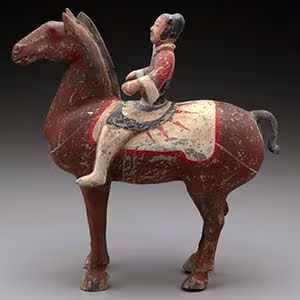 Sculpture of a man riding a horse.