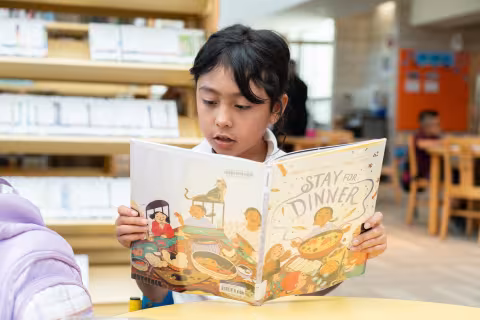 kid reading book