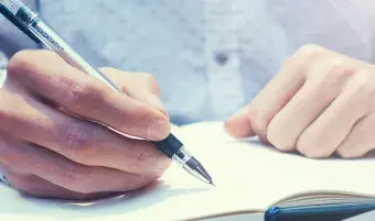 Person writing in a journal
