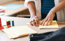 person binding a book