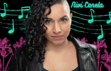 Nivi Canela in front of neon musical notes drawing