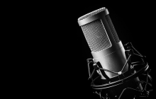 professional microphone against a black background