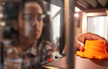 girl grabbing a 3D printed object