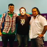 three middle aged dudes standing in front of the teen'scape sign