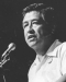Cesar Chavez speaking into a microphone