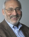 Joseph Stiglitz in glasses and a blue shirt