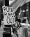 photo of a sign that reads: Putins Puppets Out