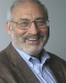 Joseph E. Stiglitz smiling and wearing glasses