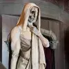 shrouded skeleton statue