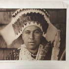 Plate 455 Tolowa Dancing Head-Dress Plate 455 Tolowa Dancing Head-Dress. Native American Tolowa man wearing a head dress, photographed looking straight into camera with plain expression