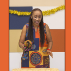 A woman with a gourd calabash hand drum.