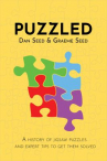 Book cover for Puzzled: A History of Jigsaw Puzzles and Expert Tips to Get Them Solved