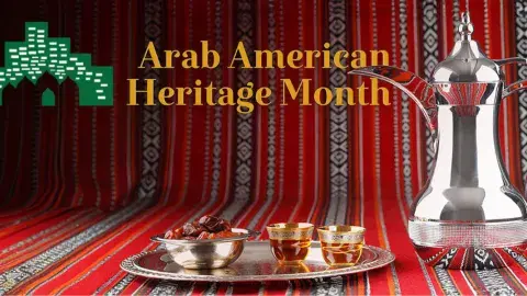An Arabic style blanket with a silver teapot and tray of dates and tea cups. Arab American Heritage Month, April 2024.