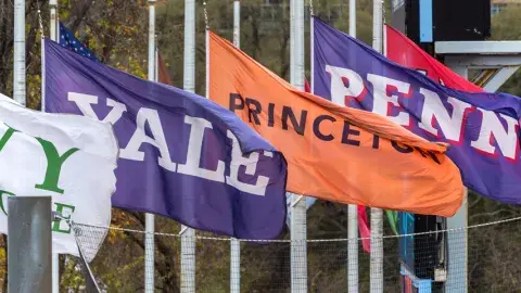 Flags of the Ivy League Universities fly over Columbia's Wien Stadium