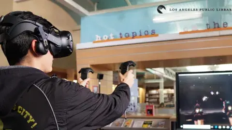 Teen using VR set at Central Library's Teen'Scape