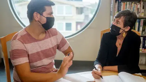 Cesar with Laurie, an adult literacy tutor