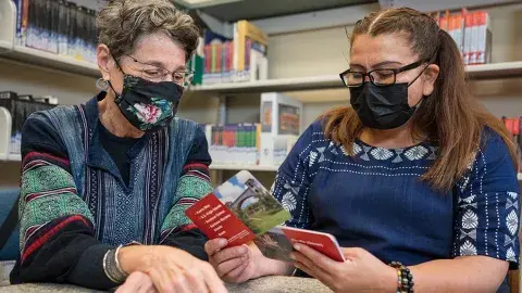 Tutor helps adult learner study for her US Citizenship