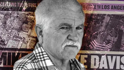 Portrait of Mike Davis against an enlarged, posterized image of his book, City of Quartz