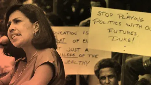 Assemblywomen Gloria Molina joins protesters opposed to $50-a-semester fee yesterday in an address to students at East Los Angeles Community College