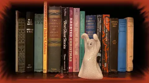 ceramic ghost on a book shelf