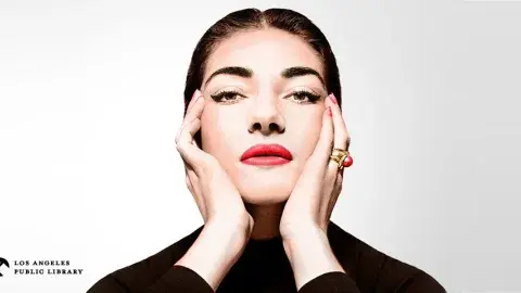 a photograph of Maria Callas wearing black looking straight into the camera