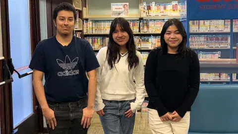 three teens at the library