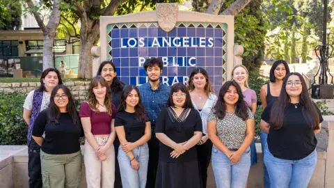 daia students in front of the central library sign