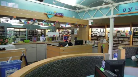 Senior Librarian Mary McCoy at the Teen'Scape Desk 