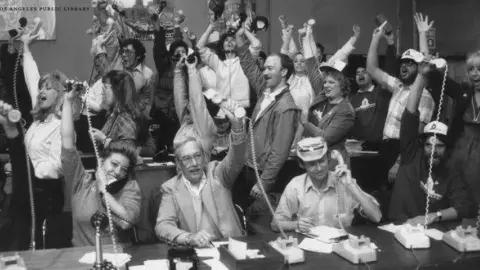 Jubilant participants during the 1987 Save the Books telethon. 