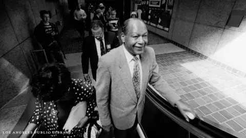 Tom Bradley on an escalator at the opening of the Red Line subway downtown, 1-30-93.