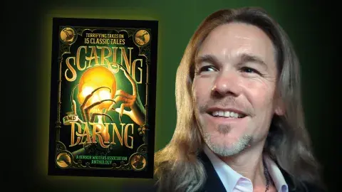 Author Eric J. Guignard and his book, Scaring and Daring: Terrifying Takes on 15 Classic Tales: A Horror Writers Association Anthology