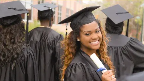 Young people at their college graduation. 