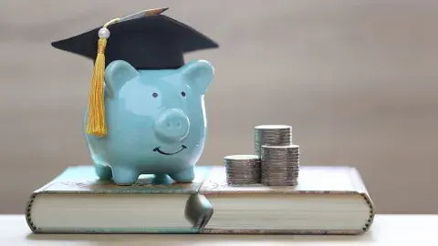 blue piggy bank with grad cap
