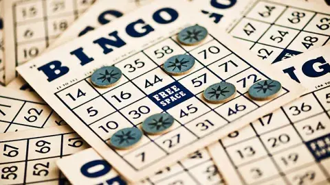 Stack of Bingo cards spread out on a surface
