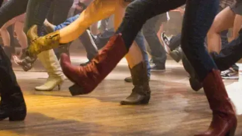 closeup of footwork during line dancing