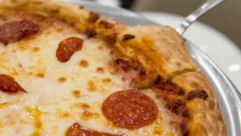 An up-close image of a pepperoni pizza