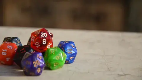 Group of orange, purple, red, green, and blue dice.