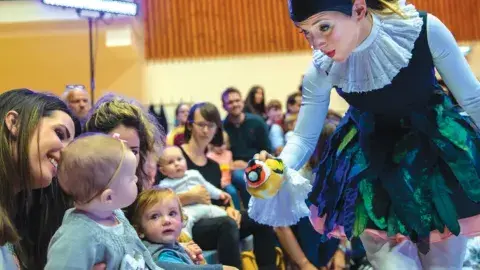 Babies with a puppet