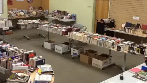 A used book sale in the library's community room